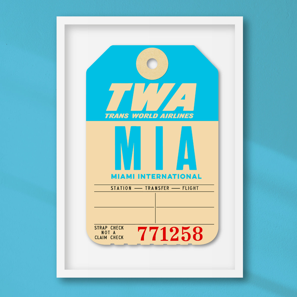 Limited-edition archival print of a TWA “Miami” luggage tag by Ella Freire, inspired by the original 1960s design, supersized in two framed sizes, float-mounted to enhance its three-dimensional effect; officially licensed by TWA (American Airlines) with signed certificate included.