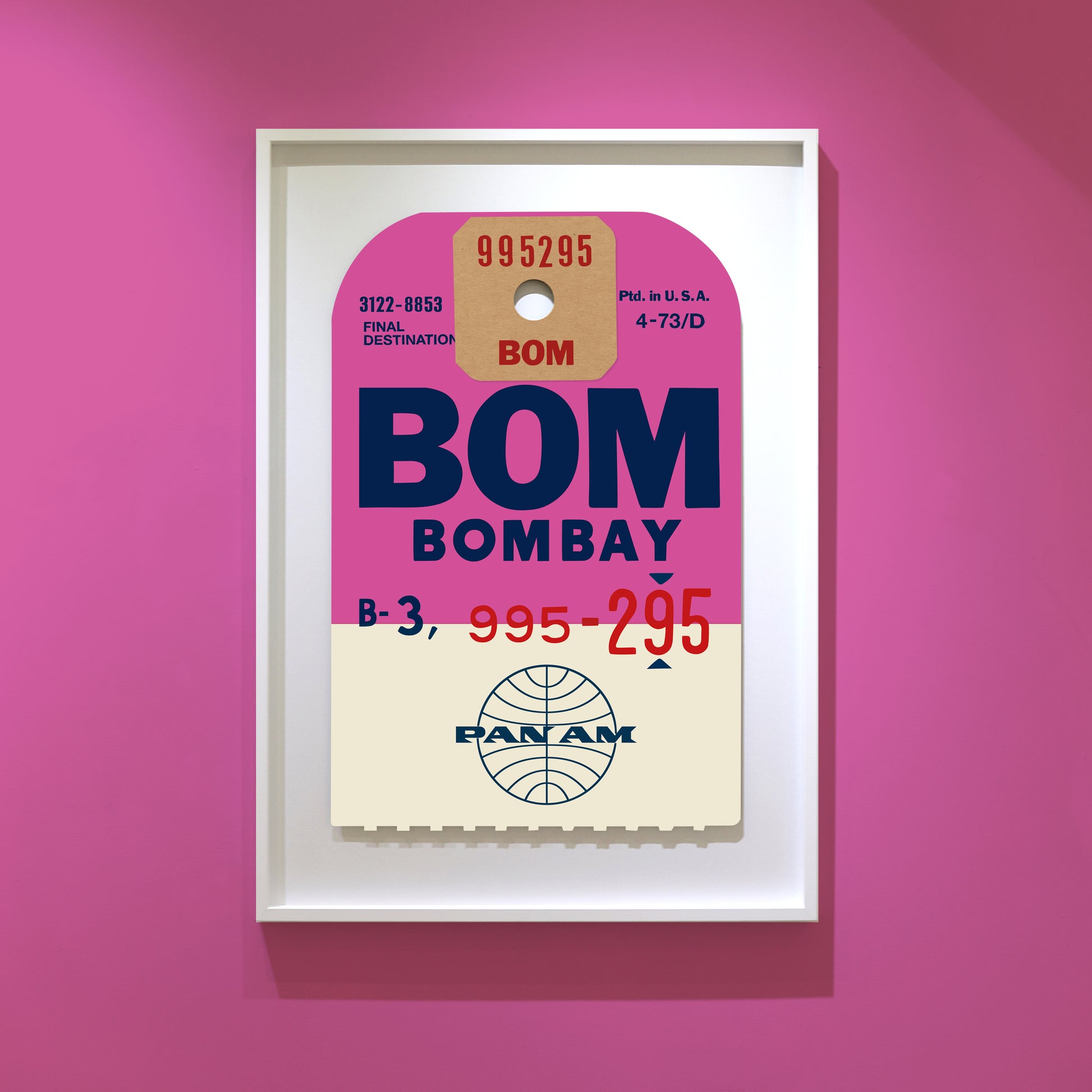 Limited-edition archival print of a Pan Am “Bombay” luggage tag by Ella Freire, inspired by the original 1960s design, supersized in two framed sizes, float-mounted to enhance its three-dimensional effect; officially licensed by Pan Am with signed certificate included.