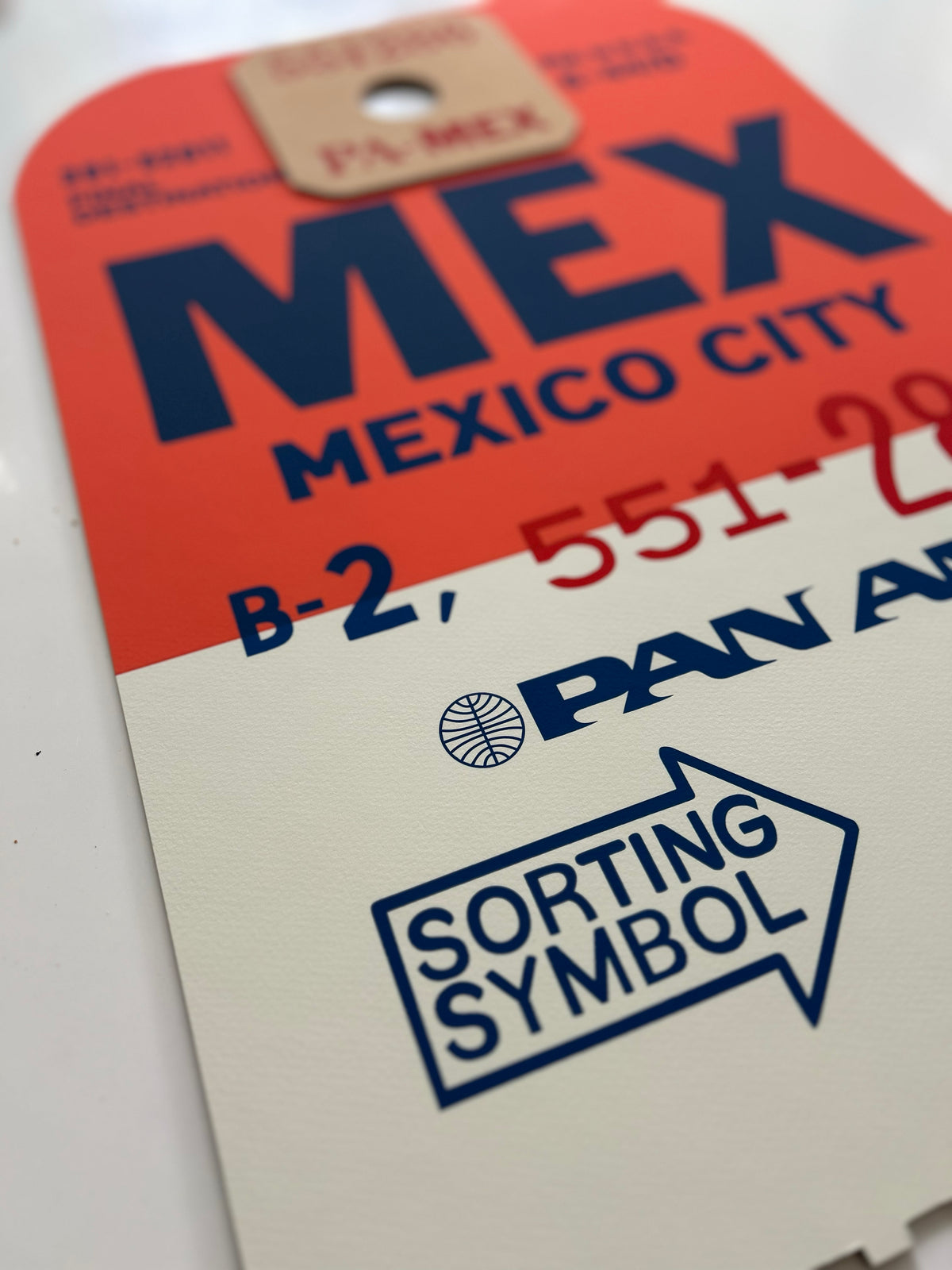 Limited-edition archival print of a Pan Am “Mexico City” luggage tag by Ella Freire, inspired by the original 1960s design, supersized in two framed sizes, float-mounted to enhance its three-dimensional effect; officially licensed by Pan Am with signed certificate included.