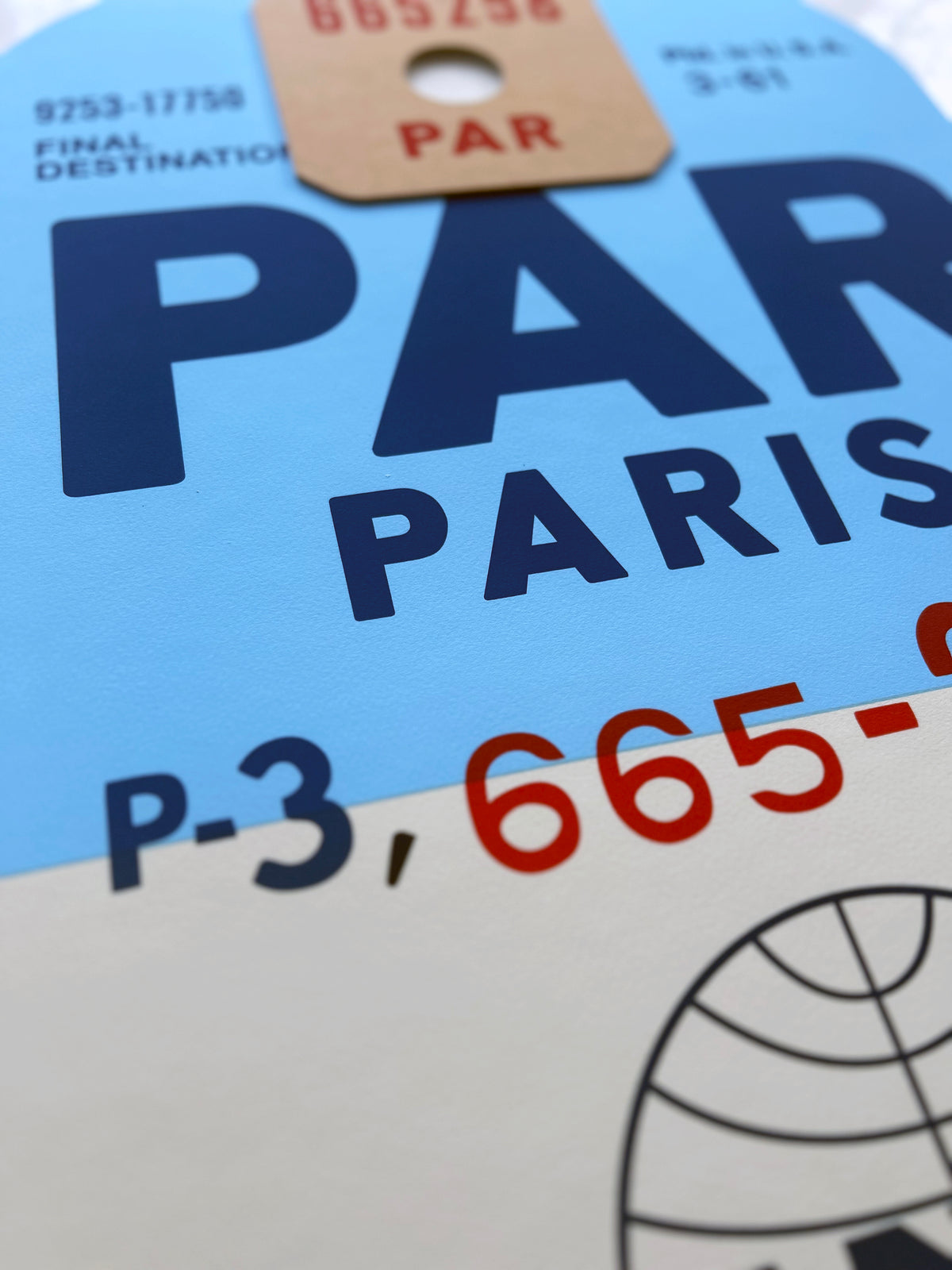 Limited-edition archival print of a Pan Am “Paris” luggage tag by Ella Freire, inspired by the original 1960s design, supersized in two framed sizes, float-mounted to enhance its three-dimensional effect; officially licensed by Pan Am with signed certificate included.