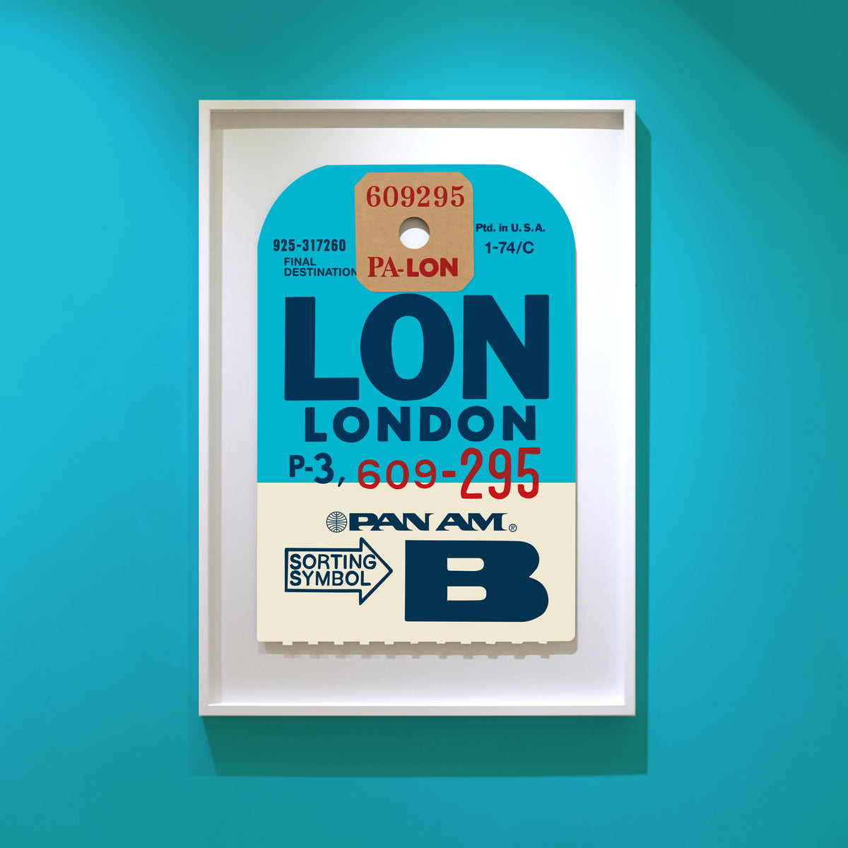 Limited-edition archival print of a Pan Am “London” luggage tag by Ella Freire, inspired by the original 1960s design, supersized in two framed sizes, float-mounted to enhance its three-dimensional effect; officially licensed by Pan Am with signed certificate included.