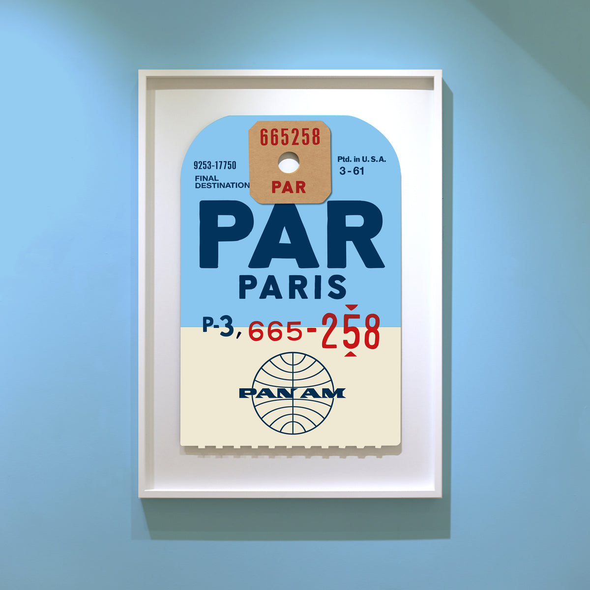 Limited-edition archival print of a Pan Am “Paris” luggage tag by Ella Freire, inspired by the original 1960s design, supersized in two framed sizes, float-mounted to enhance its three-dimensional effect; officially licensed by Pan Am with signed certificate included.