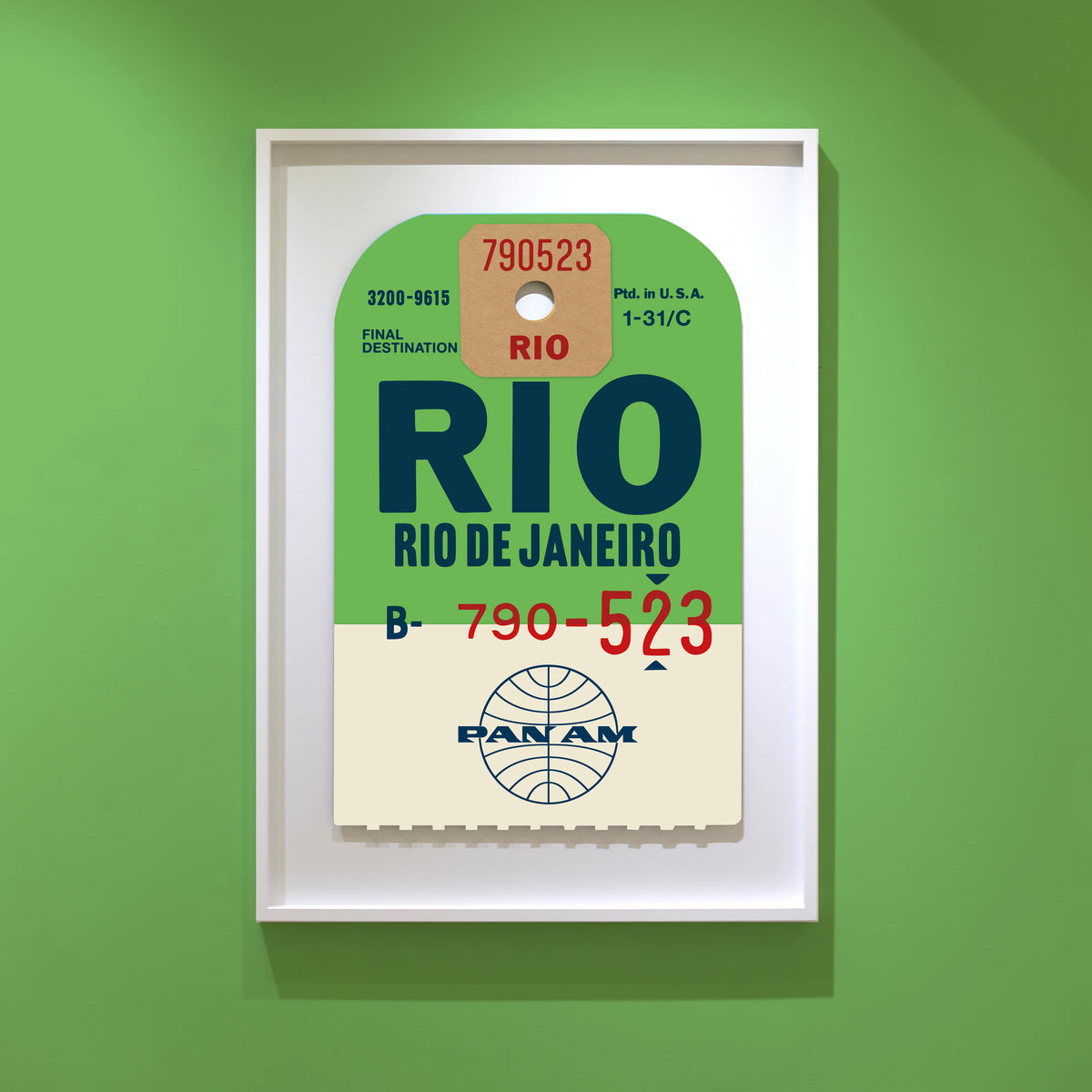 Limited-edition archival print of a Pan Am “Rio de Janeiro” luggage tag by Ella Freire, inspired by the original 1960s design, supersized in two framed sizes, float-mounted to enhance its three-dimensional effect; officially licensed by Pan Am with signed certificate included.
