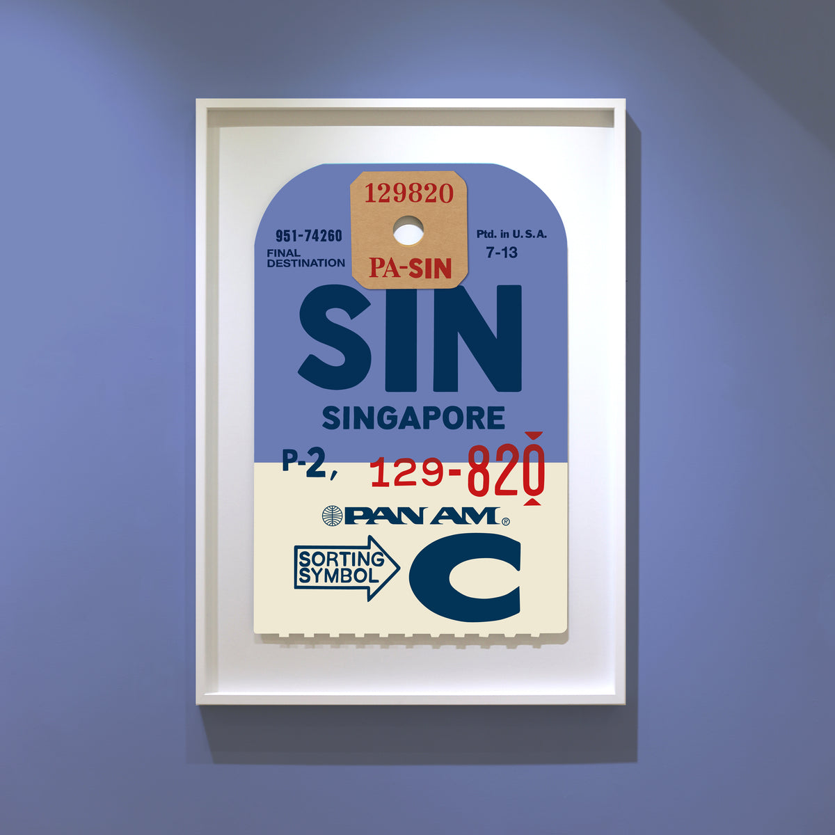 Limited-edition archival print of a Pan Am “Singapore” luggage tag by Ella Freire, inspired by the original 1960s design, supersized in two framed sizes, float-mounted to enhance its three-dimensional effect; officially licensed by Pan Am with signed certificate included.