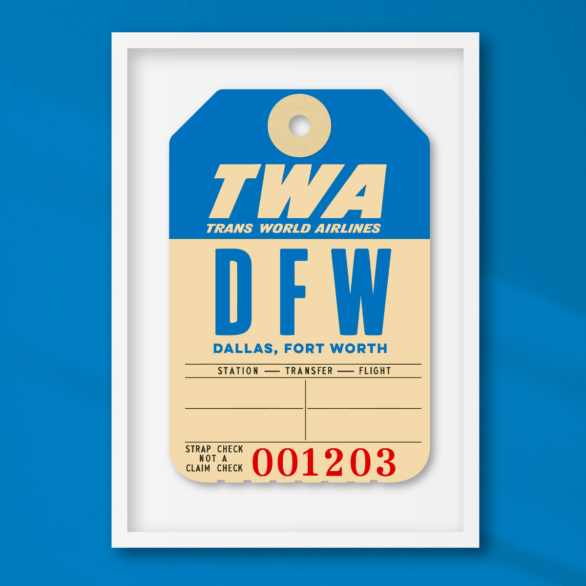 Limited-edition archival print of a TWA “Dallas” luggage tag by Ella Freire, inspired by the original 1960s design, supersized in two framed sizes, float-mounted to enhance its three-dimensional effect; officially licensed by TWA (American Airlines) with signed certificate included.