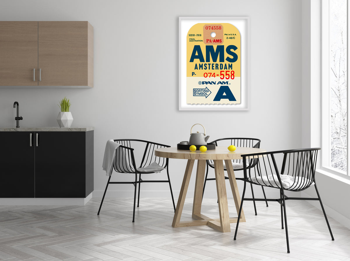 Limited-edition archival print of a Pan Am “Amsterdam” luggage tag by Ella Freire, inspired by the original 1960s design, supersized in two framed sizes, float-mounted to enhance its three-dimensional effect; officially licensed by Pan Am with signed certificate included.