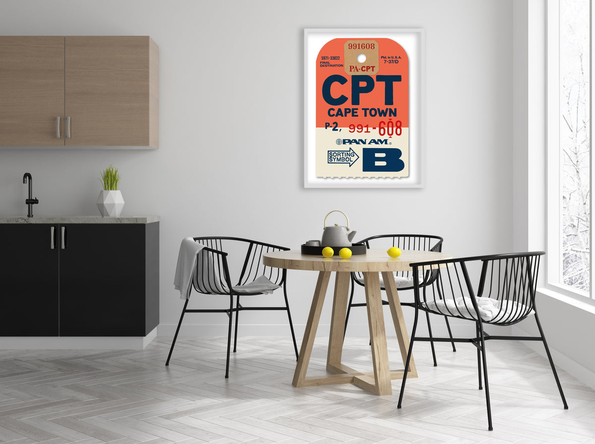 Limited-edition archival print of a Pan Am “Cape Town” luggage tag by Ella Freire, inspired by the original 1960s design, supersized in two framed sizes, float-mounted to enhance its three-dimensional effect; officially licensed by Pan Am with signed certificate included.