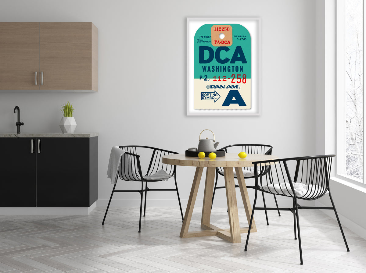 Limited-edition archival print of a Pan Am “Washington” luggage tag by Ella Freire, inspired by the original 1960s design, supersized in two framed sizes, float-mounted to enhance its three-dimensional effect; officially licensed by Pan Am with signed certificate included.