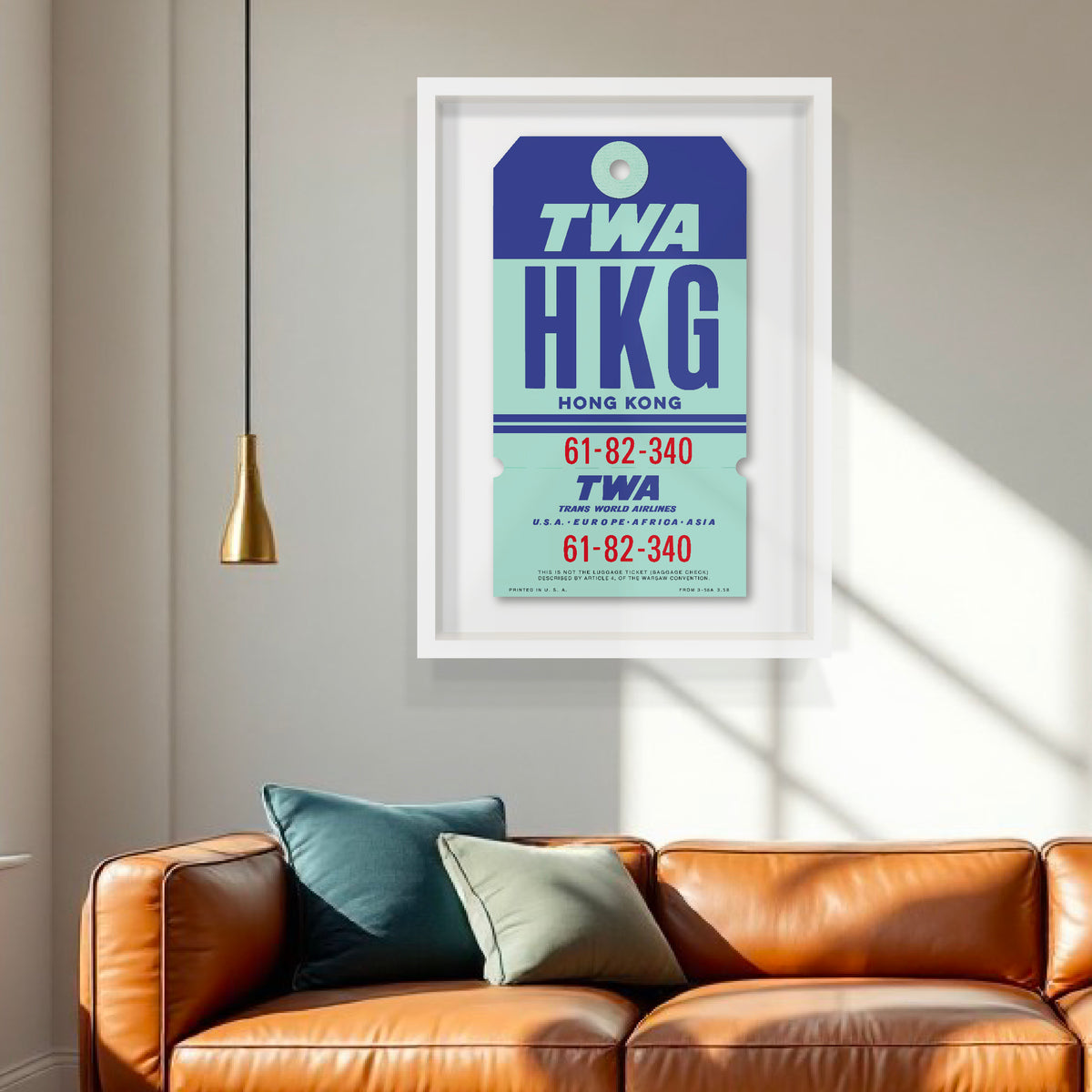 Limited-edition archival print of a TWA “Hong Kong” luggage tag by Ella Freire, inspired by the original 1960s design, supersized in one framed size only, float-mounted to enhance its three-dimensional effect; officially licensed by TWA (American Airlines) with signed certificate included.