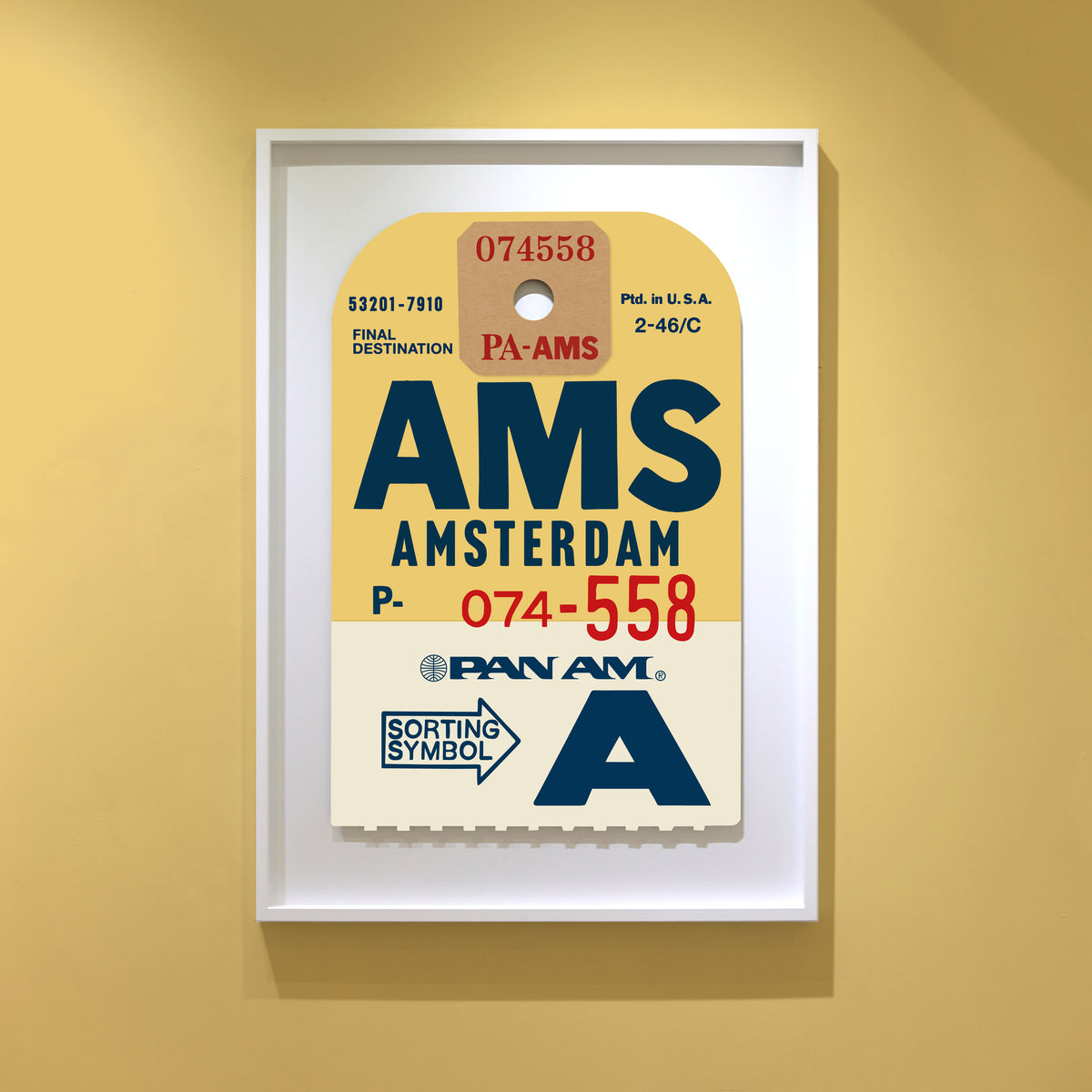 Limited-edition archival print of a Pan Am “Amsterdam” luggage tag by Ella Freire, inspired by the original 1960s design, supersized in two framed sizes, float-mounted to enhance its three-dimensional effect; officially licensed by Pan Am with signed certificate included.