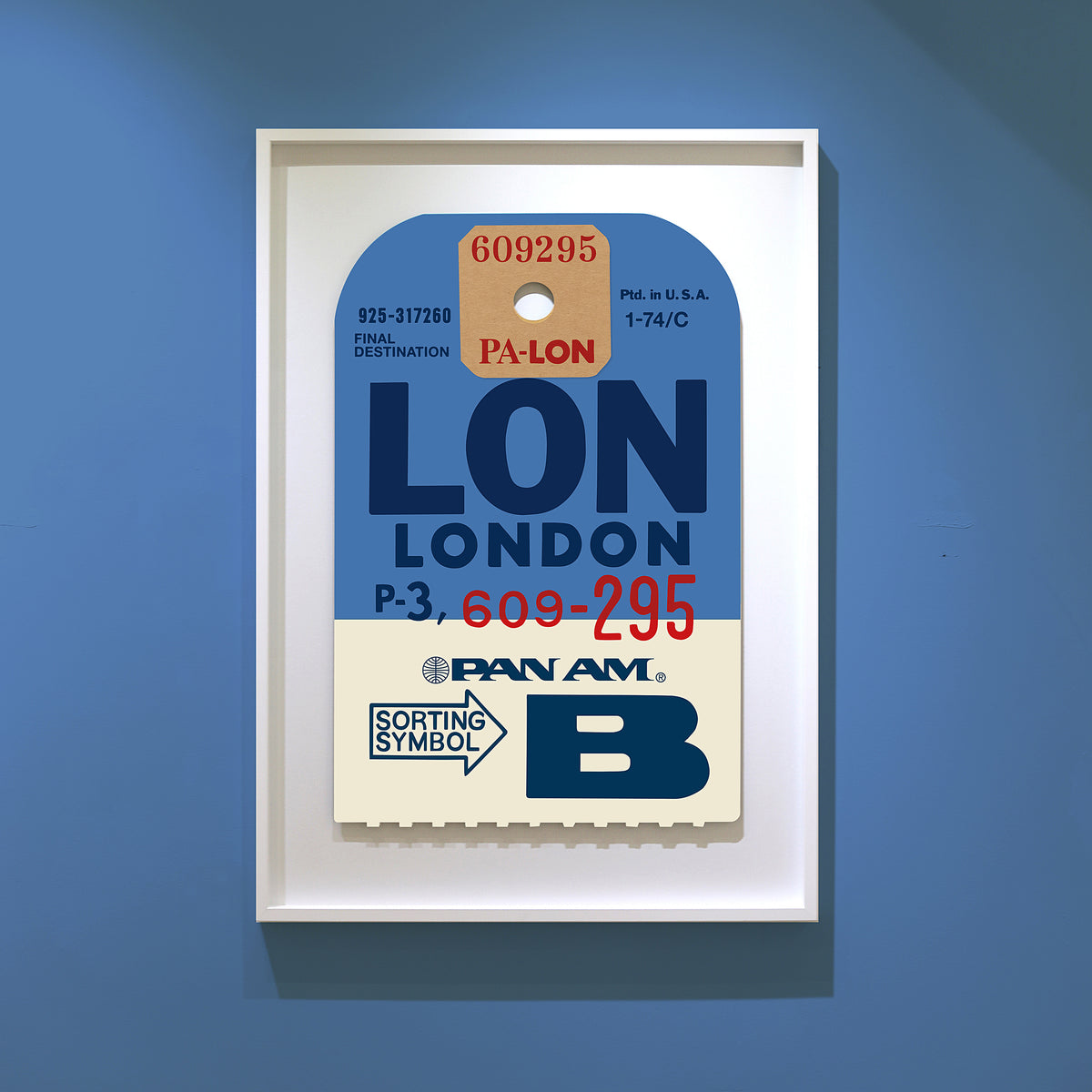 Limited-edition archival print of a Pan Am “London” luggage tag by Ella Freire, inspired by the original 1960s design, supersized in two framed sizes, float-mounted to enhance its three-dimensional effect; officially licensed by Pan Am with signed certificate included.