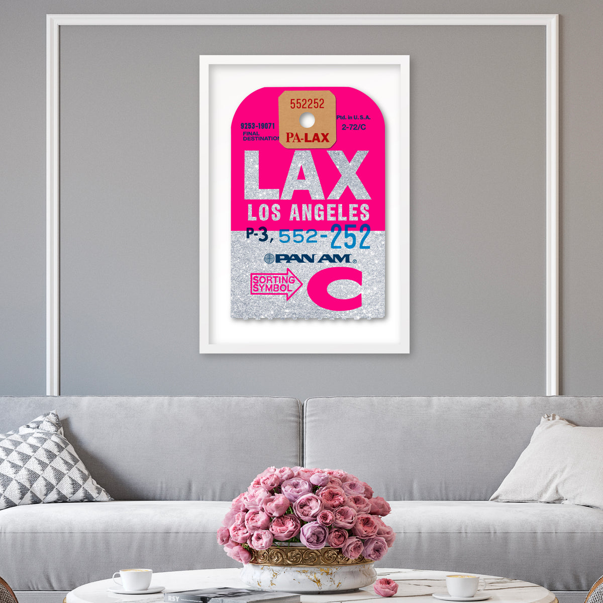 Limited-edition archival print onto sliver glitter paper of a Pan Am “Los Angeles” luggage tag by Ella Freire, inspired by the original 1960s design, supersized to a large size, float-mounted to enhance its three-dimensional effect; officially licensed by Pan Am with signed certificate included.