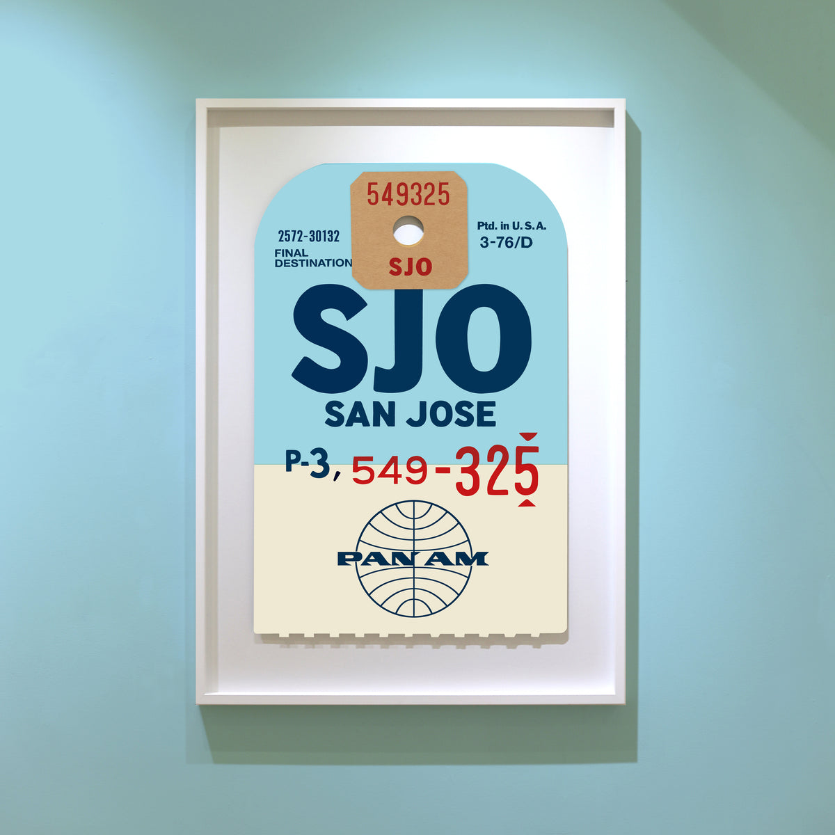 Limited-edition archival print of a Pan Am “San Jose” luggage tag by Ella Freire, inspired by the original 1960s design, supersized in two framed sizes, float-mounted to enhance its three-dimensional effect; officially licensed by Pan Am with signed certificate included.