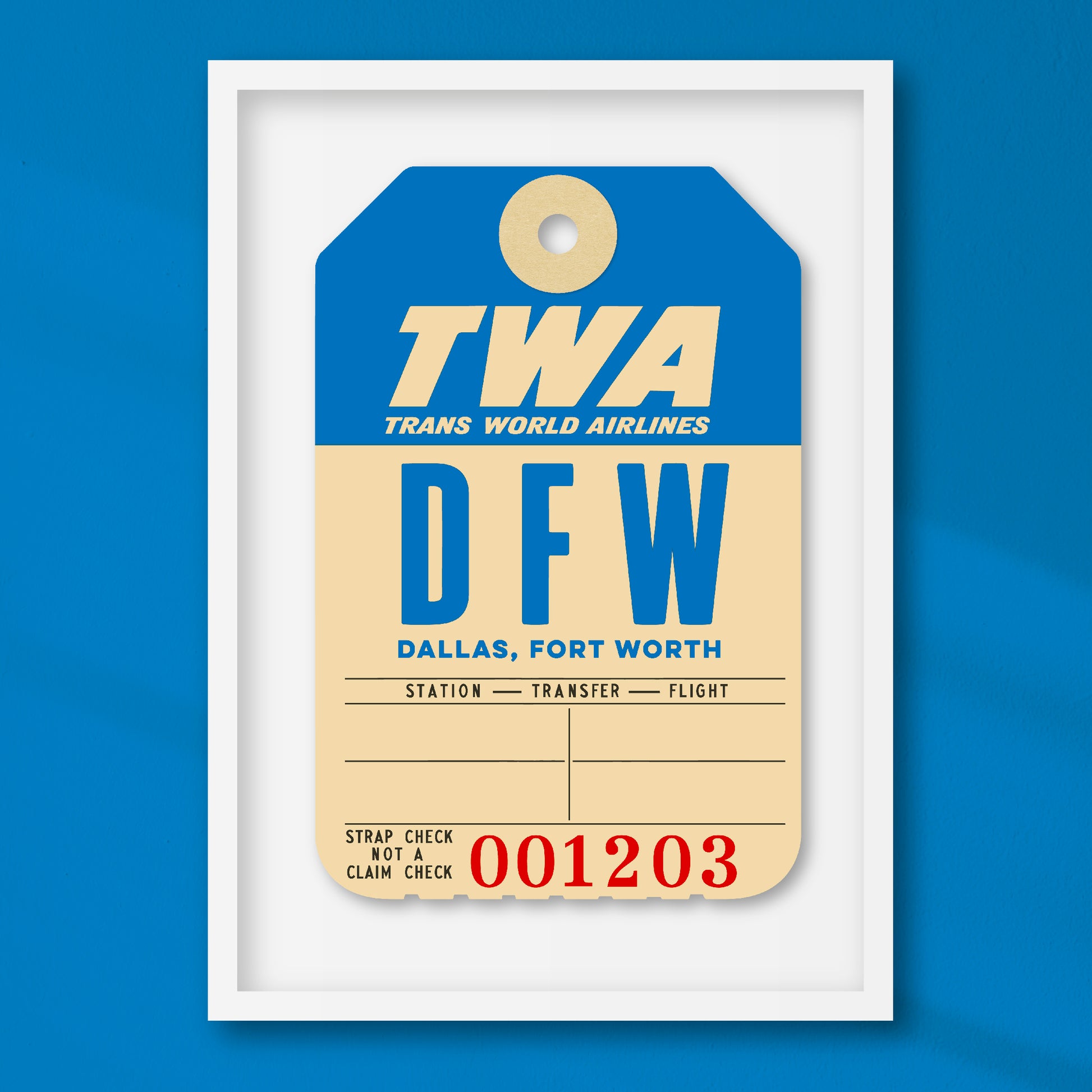 Limited-edition archival print of a TWA “Dallas” luggage tag by Ella Freire, inspired by the original 1960s design, supersized in two framed sizes, float-mounted to enhance its three-dimensional effect; officially licensed by TWA (American Airlines) with signed certificate included.