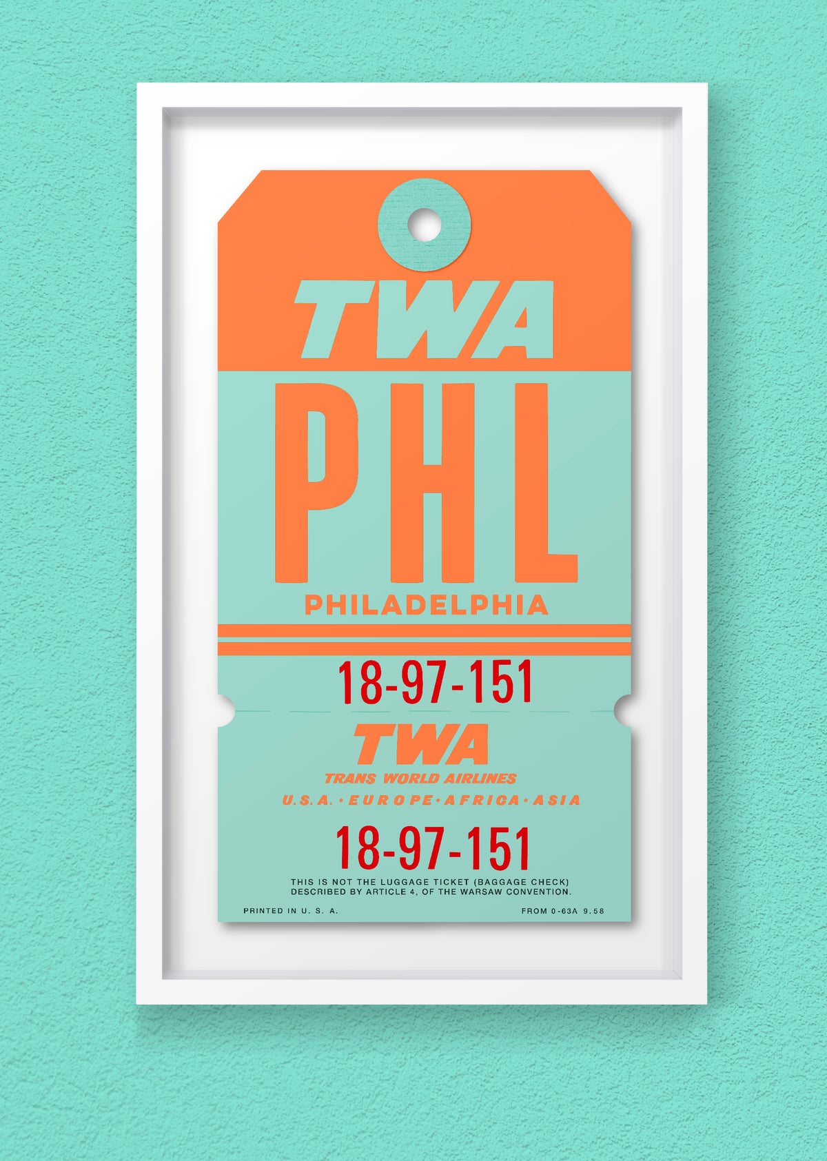 Limited-edition archival print of a TWA “Philadelphia” luggage tag by Ella Freire, inspired by the original 1960s design, supersized in one framed size only, float-mounted to enhance its three-dimensional effect; officially licensed by TWA (American Airlines) with signed certificate included.
