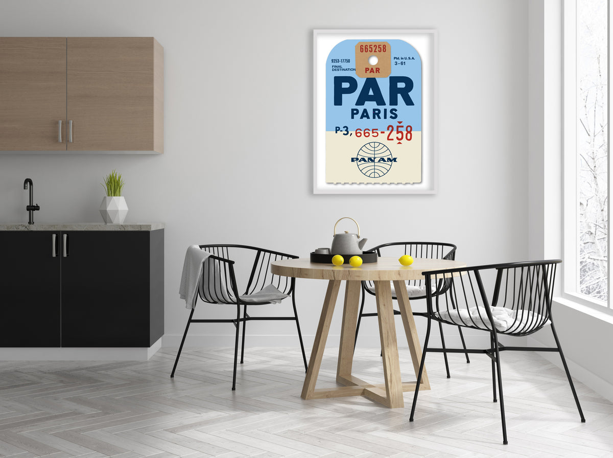 Limited-edition archival print of a Pan Am “Paris” luggage tag by Ella Freire, inspired by the original 1960s design, supersized in two framed sizes, float-mounted to enhance its three-dimensional effect; officially licensed by Pan Am with signed certificate included.