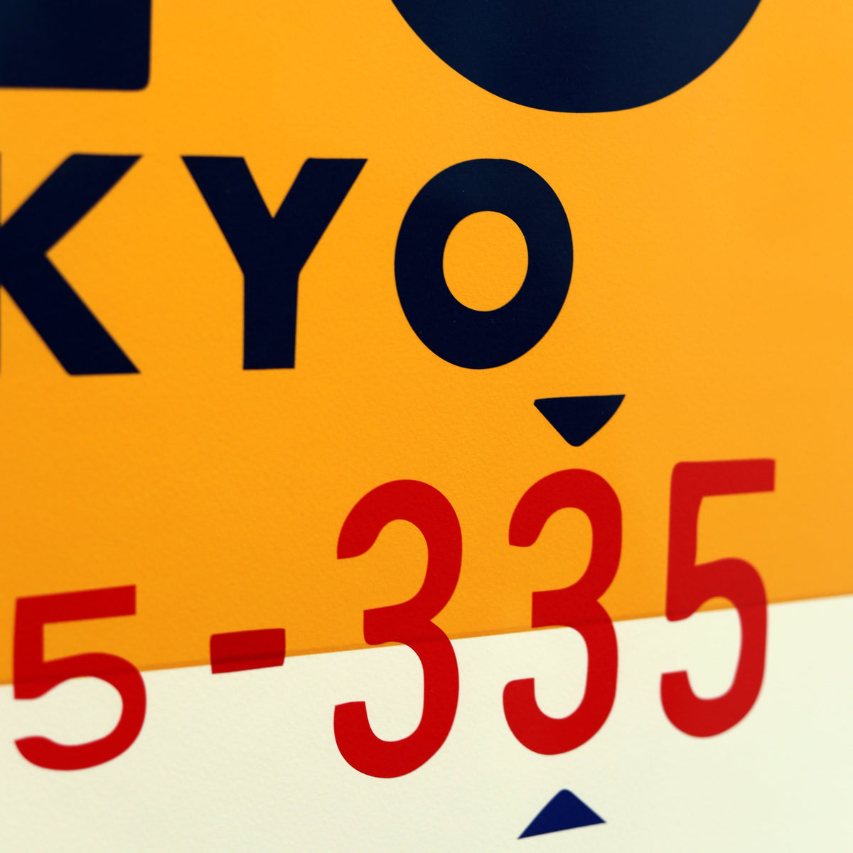 Limited-edition archival print of a Pan Am “Tokyo” luggage tag by Ella Freire, inspired by the original 1960s design, supersized in two framed sizes, float-mounted to enhance its three-dimensional effect; officially licensed by Pan Am with signed certificate included.