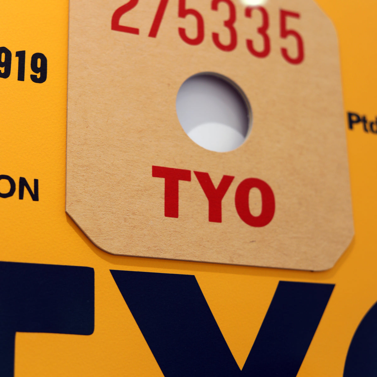 Limited-edition archival print of a Pan Am “Tokyo” luggage tag by Ella Freire, inspired by the original 1960s design, supersized in two framed sizes, float-mounted to enhance its three-dimensional effect; officially licensed by Pan Am with signed certificate included.